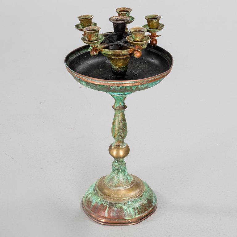 a metal sculpture group in eight parts, partly signed.