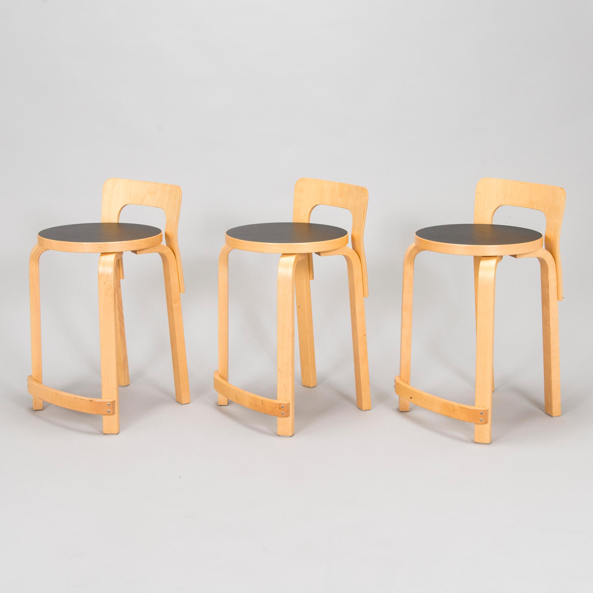 Alvar Aalto, a table and three chairs, Artek 2006 and 2007.