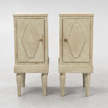 A pair of painted bedside tables. 20th Century.