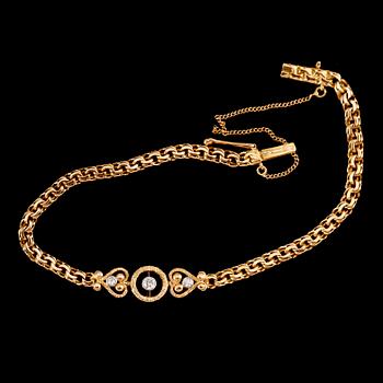 ARMBAND, 18 k guld, med 3 briljanter, daterad 1920. Vikt ca 12 gram.