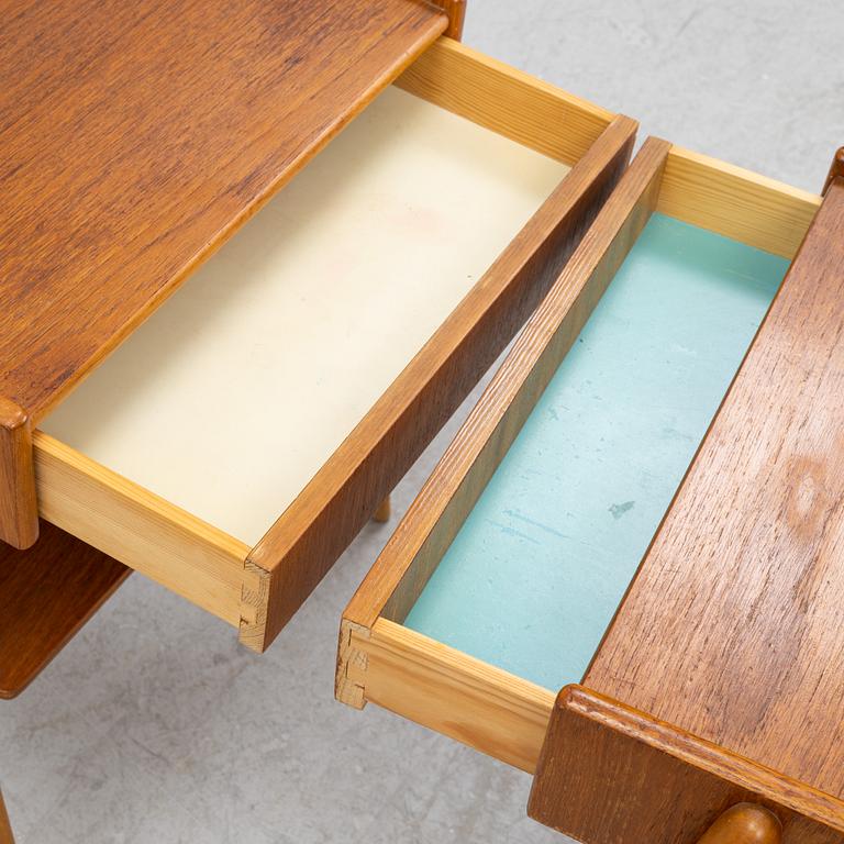 A pair of teak veneered bedside tables, 1960's.