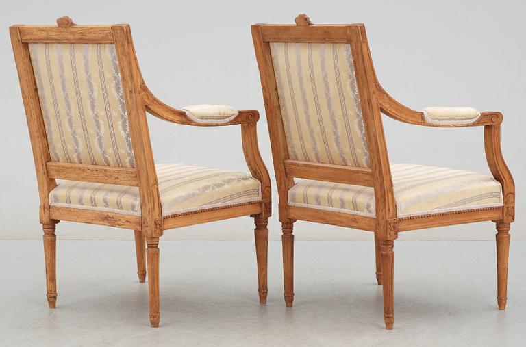 A Gustavian 18th century suite of furniture comprising a pair of armchairs and a sofa.