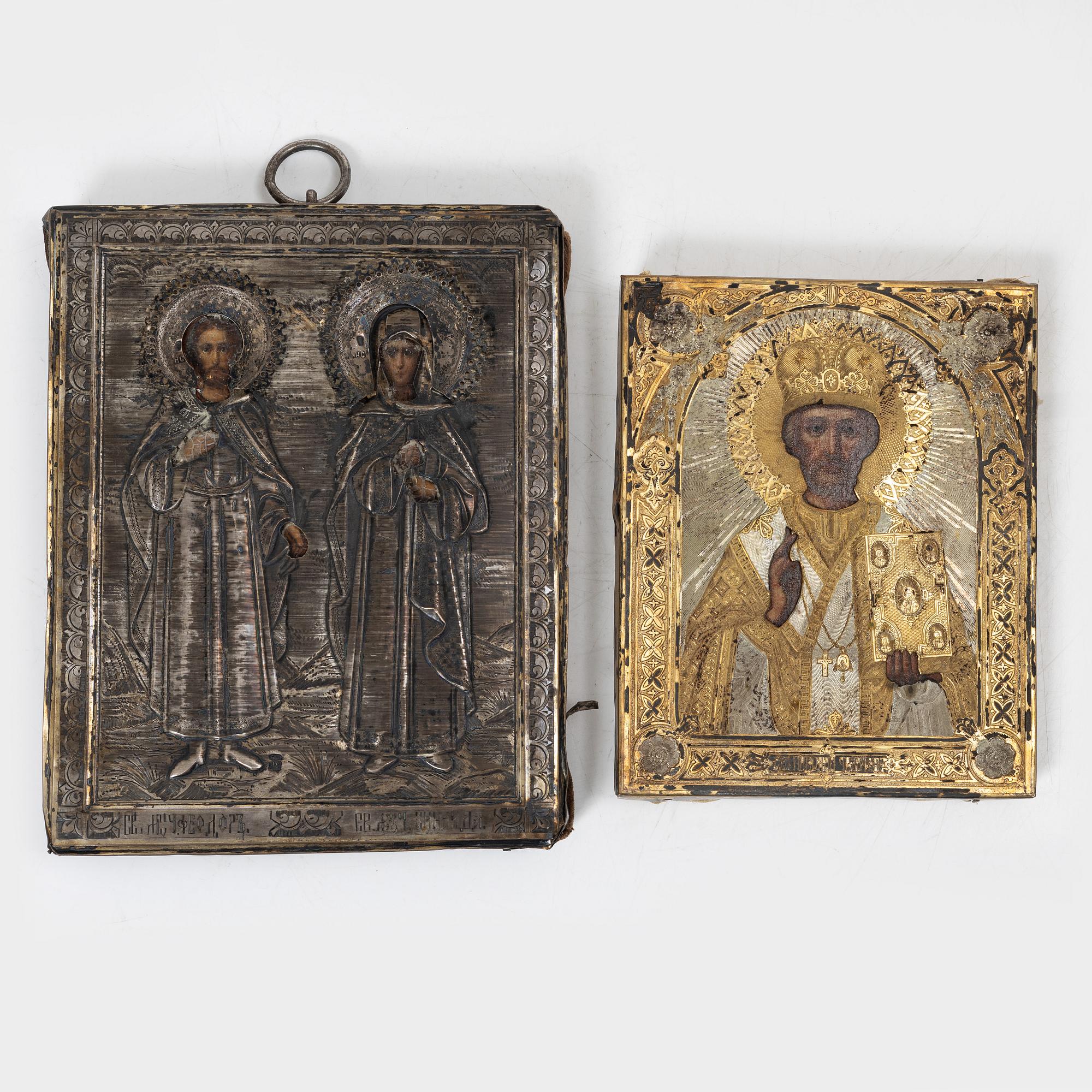 Two Russian icons with oklad, of which one in silver with stamps Moscow 1908-1926.