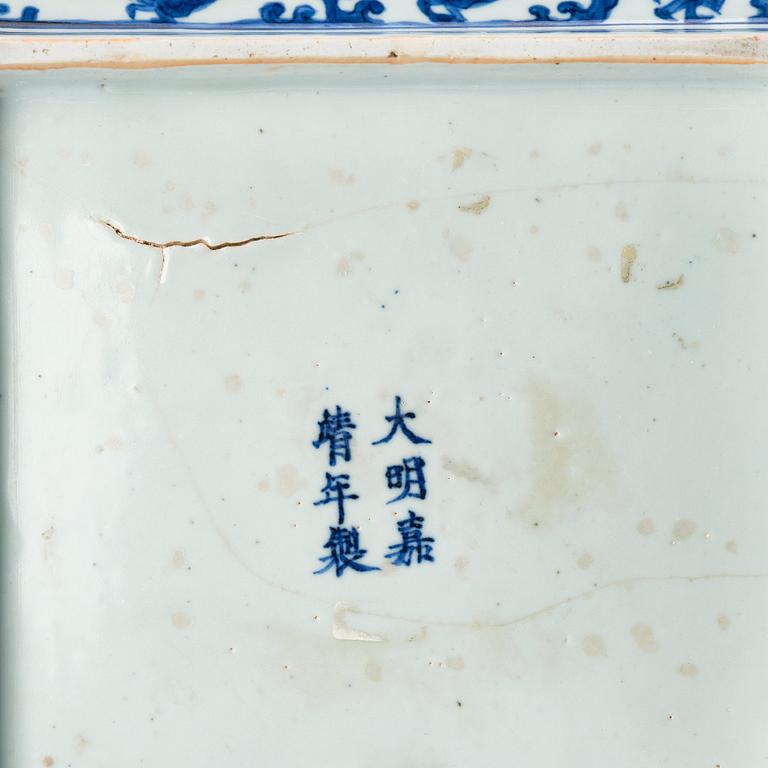 A blue and white dragon dish, Ming dynasty with Jiajings six character mark and of the period (1522-66).