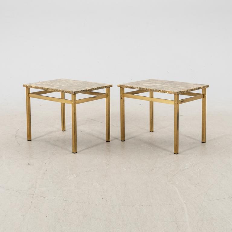 A pair of metal and stone side tables from the second half of the 20th century.