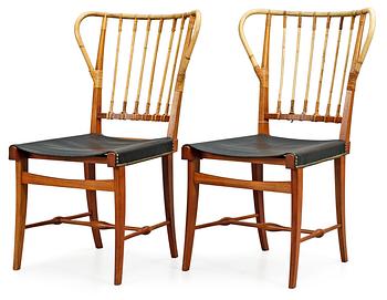 461. A pair of Josef Frank mahogany, bamboo and black leather chairs, Svenskt Tenn, model 1179.