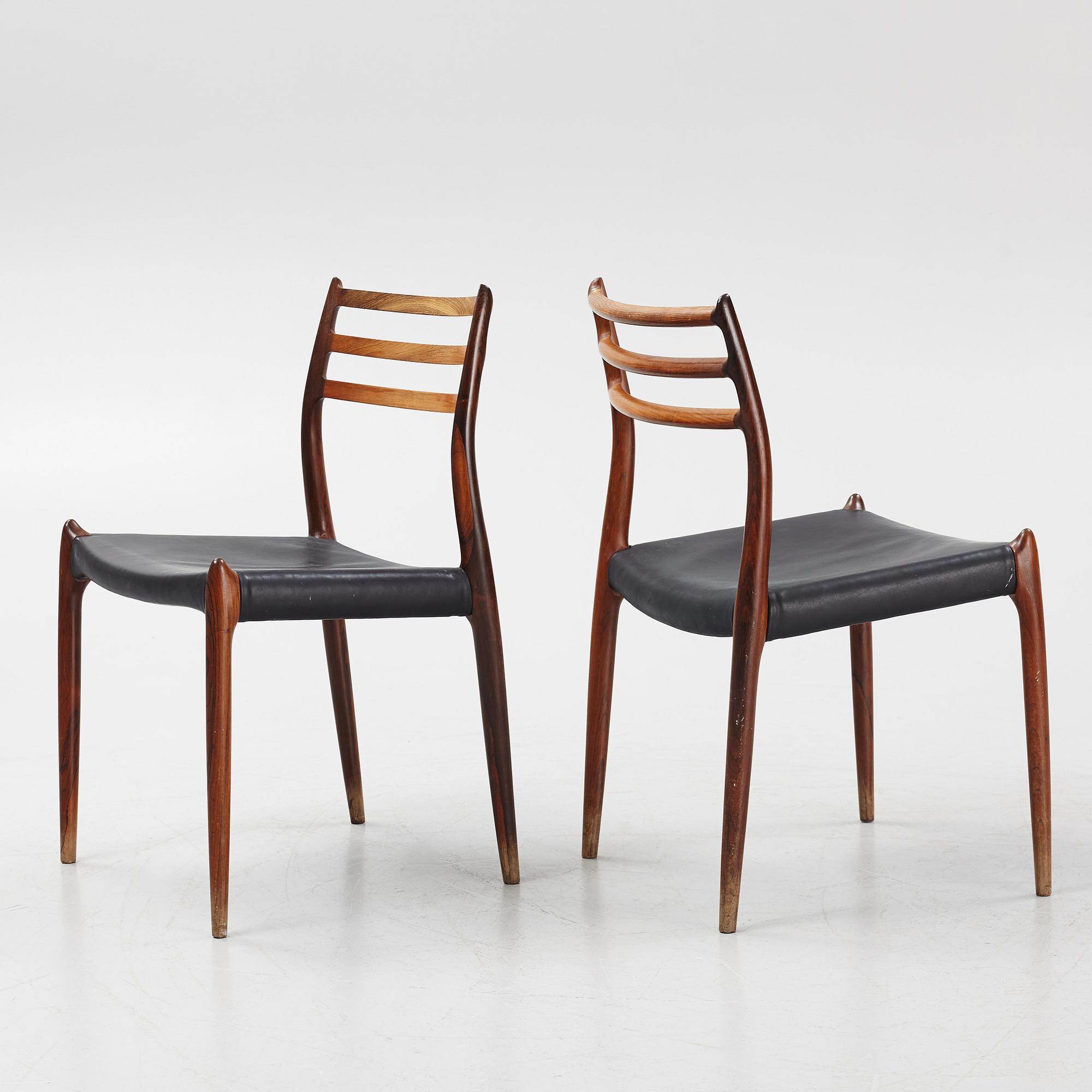 Niles Otto Møller, a rosewood veneered table with four chairs, JL Møller, Denmark, 1950's/60's.