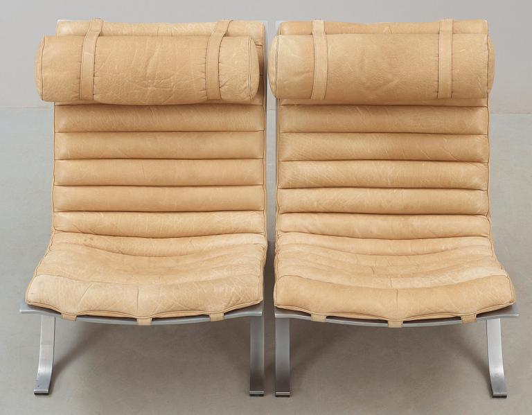 A pair of Arne Norell 'Ari' steel and leather easy chairs, Norell.