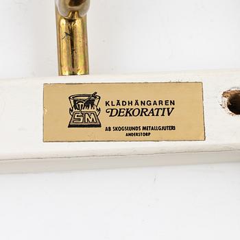 A set of three 'Dekorativ' coat hangers, Skogslunds Metallgjuteri, Anderstorp.