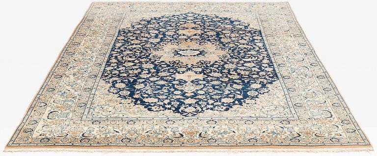 A carpet, semi-antique, part silk Nain, so called 4 Laa, ca 320 x 210,5 cm.