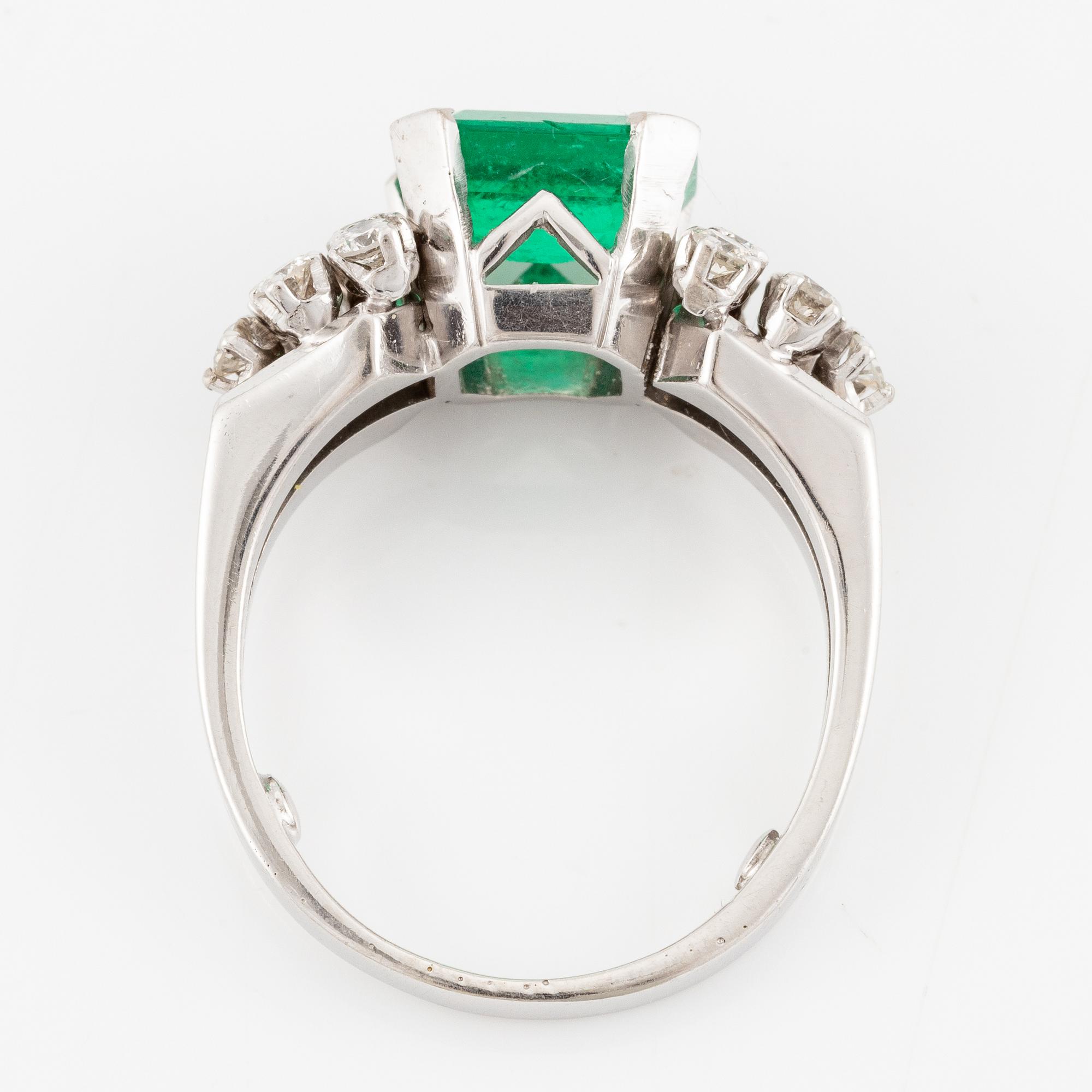 A W.A. Bolin ring 18K white gold with an emerald-cut emerald and brilliant-cut diamonds.