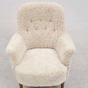 Carl Malmsten, a "husmor" armchair, O.H. Sjögren, Sweden, 1984.