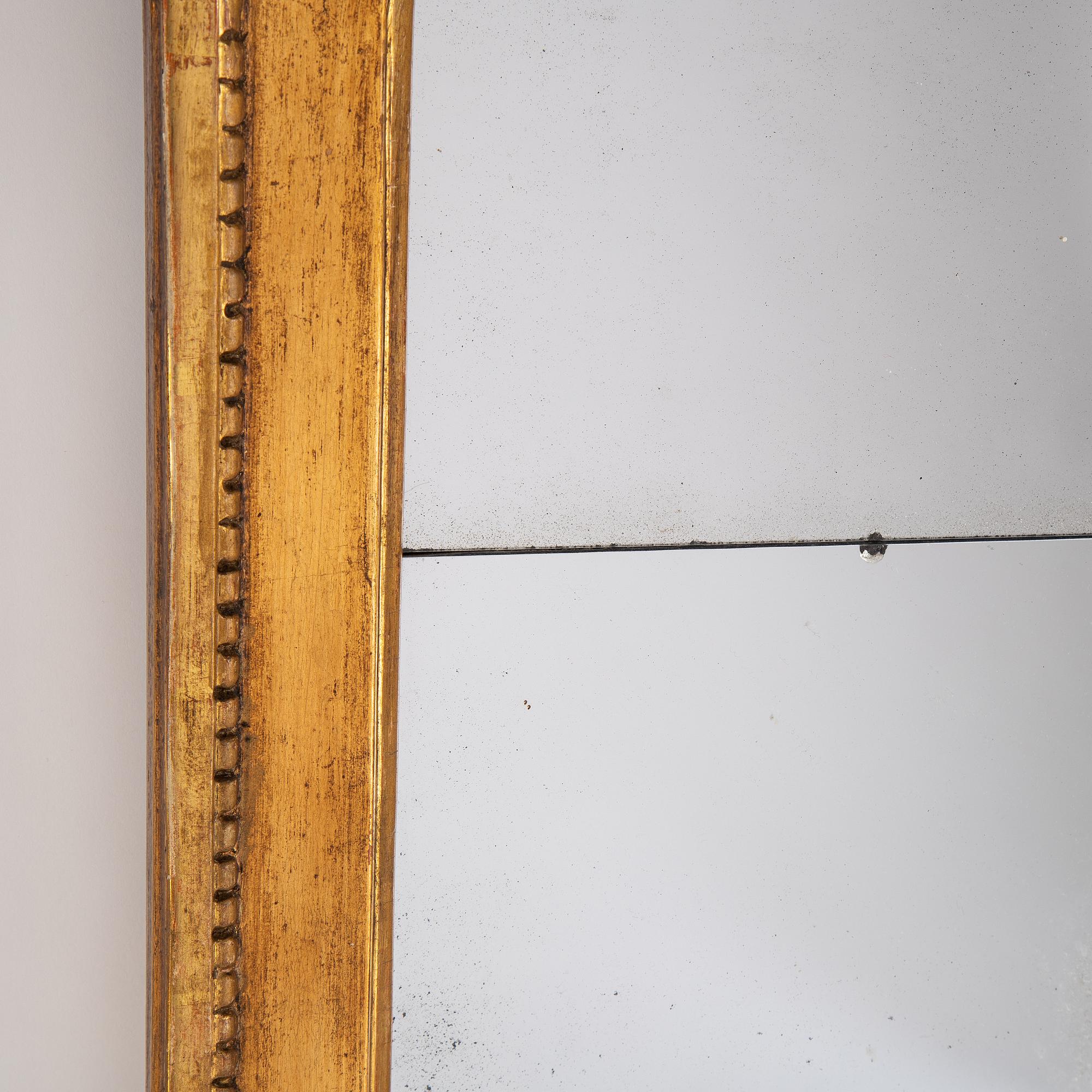 A gilt mirror, Stockholm, second half of the 18th Century.