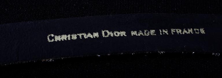 An ensemble consisting of skirt, top, belt and scarf by Christian Dior.