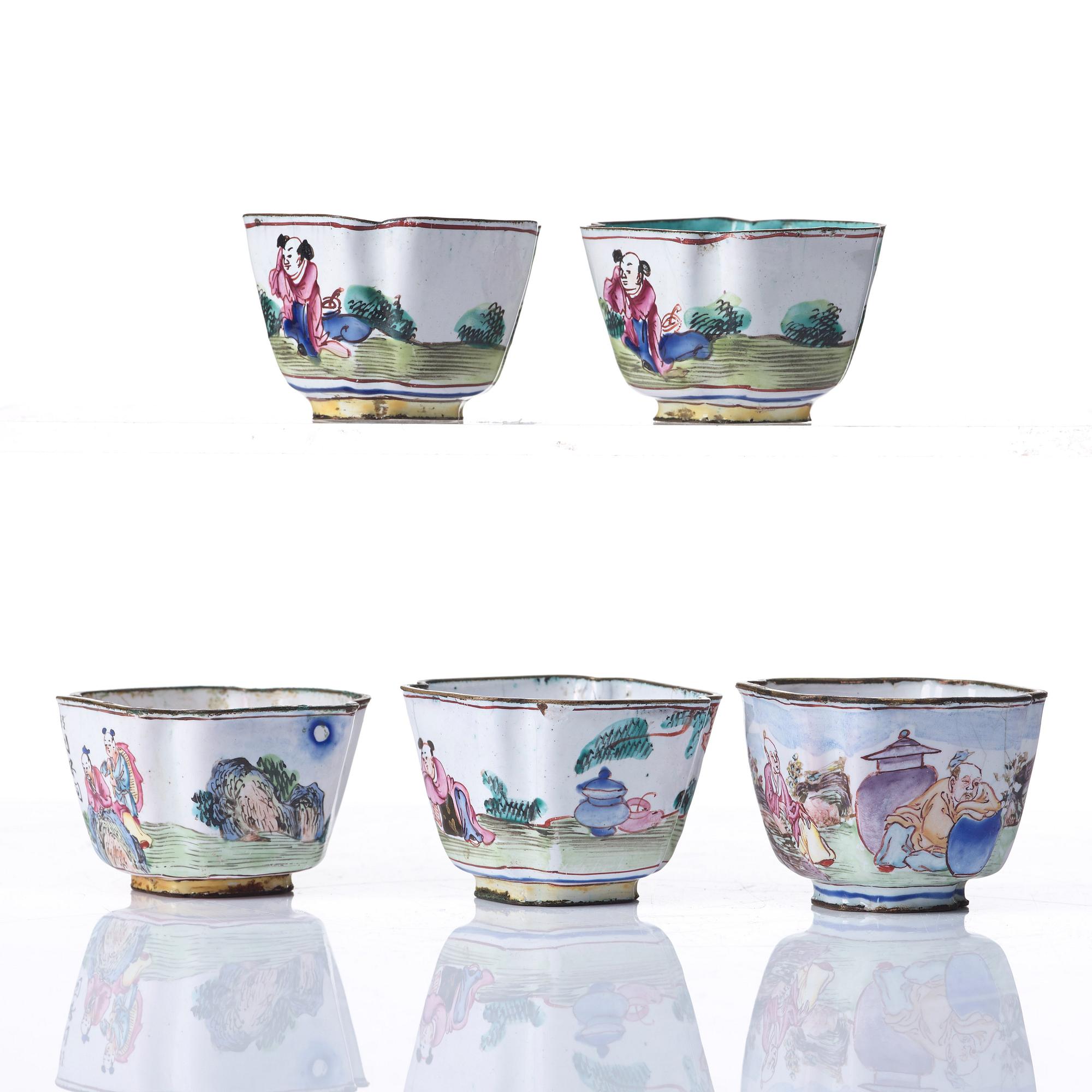 A set of five enamel on copper tea cups and a dish, Qing dynasty, circa 1800.