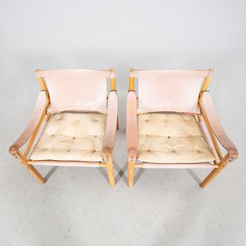 A pair of oak and leather 'Sirocco' easy chairs by Arne Norell for Norell Möbel AB, second half of the 20th century.