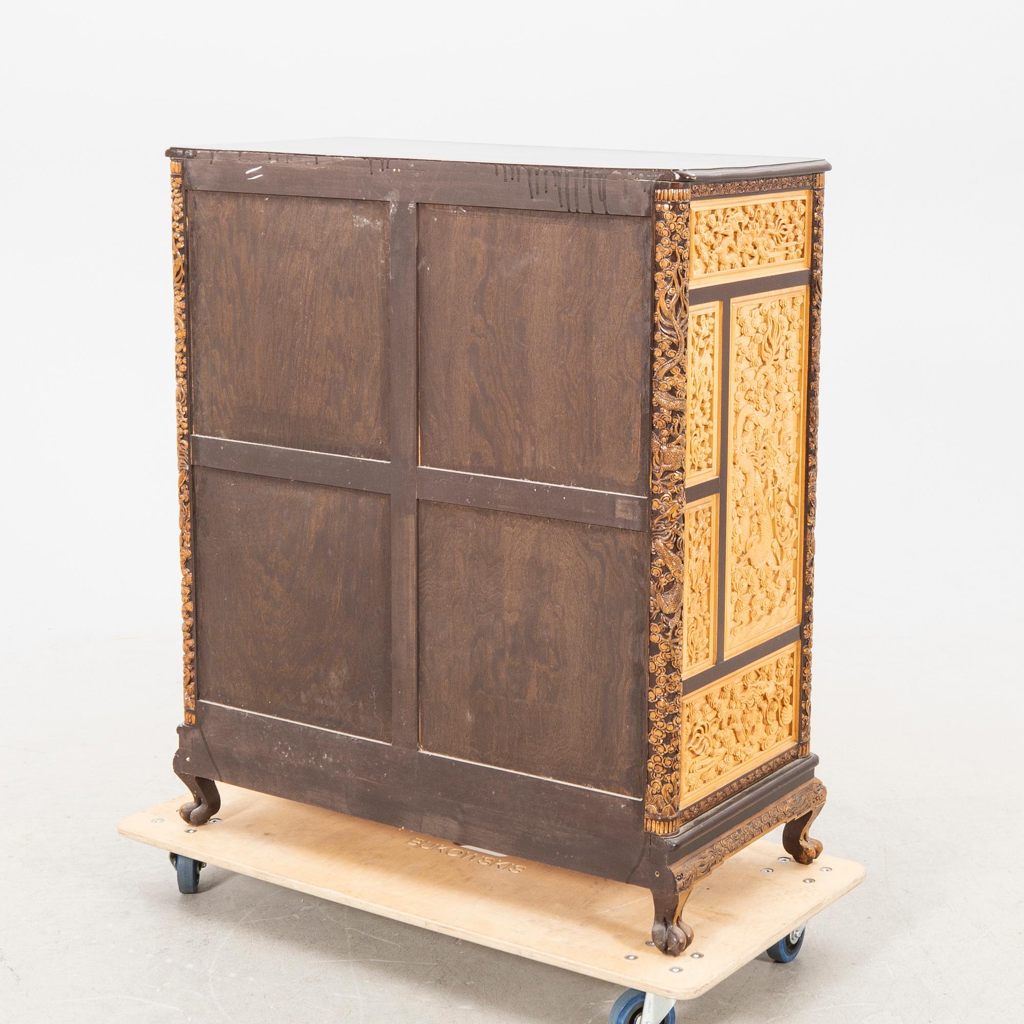 A Chinese wooden cabinet  mid 1900s.