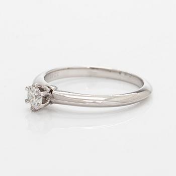 Tiffany & Co, a platinum solitaire ring with a brilliant-cut diamond.
