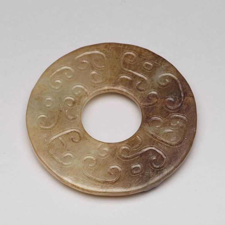 An archaistic Chinese nephrite cong and bi disc.