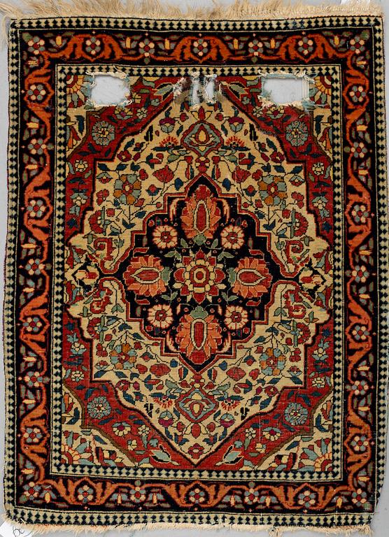 A RUG, a semi-antique Kashan Motachem, ca 84 x 64 cm.