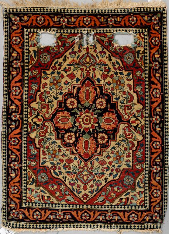 A RUG, a semi-antique Kashan Motachem, ca 84 x 64 cm.