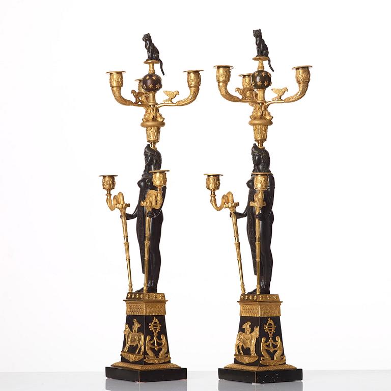 A pair of Russian Retour d'Egypte Empire Alexander I five-light candelabra, St. Petersburg.