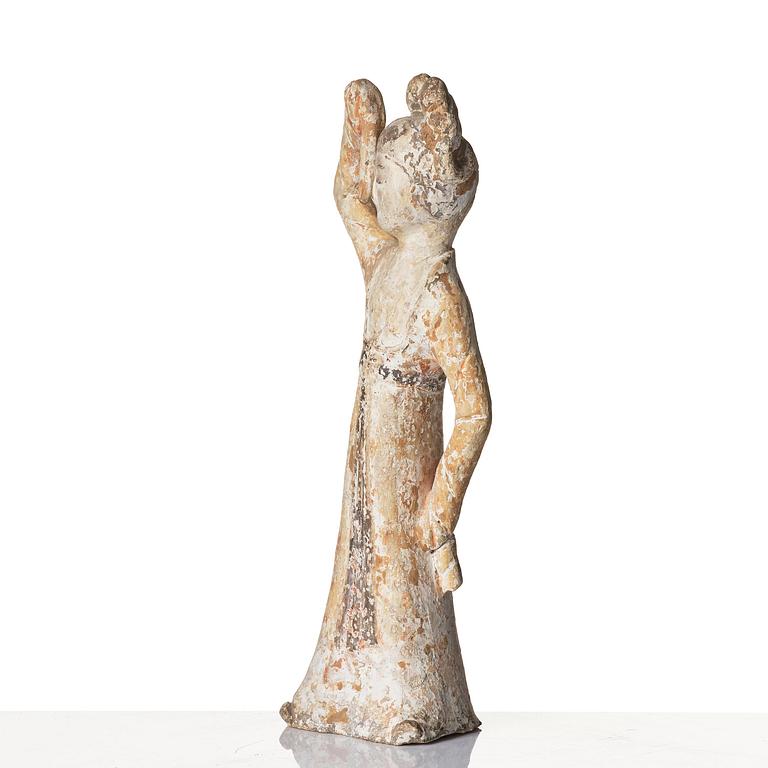 A painted pottery figure of a female dancer, Tang dynasty (608-906).