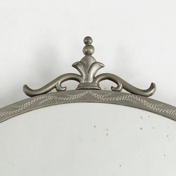 A 1930's pewter mirror.