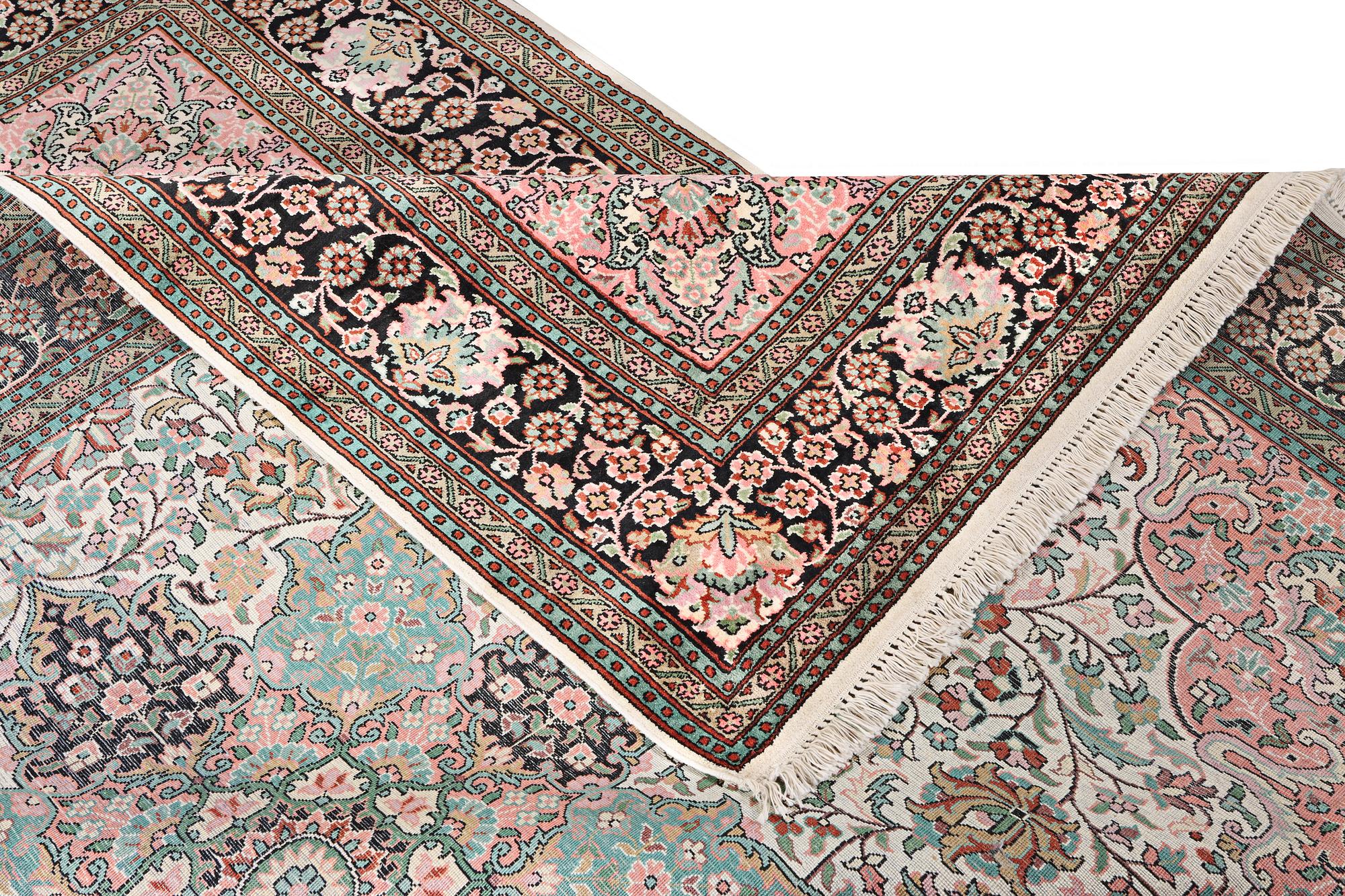 A silk Kashmir carpet, c. 267 x 185 cm.