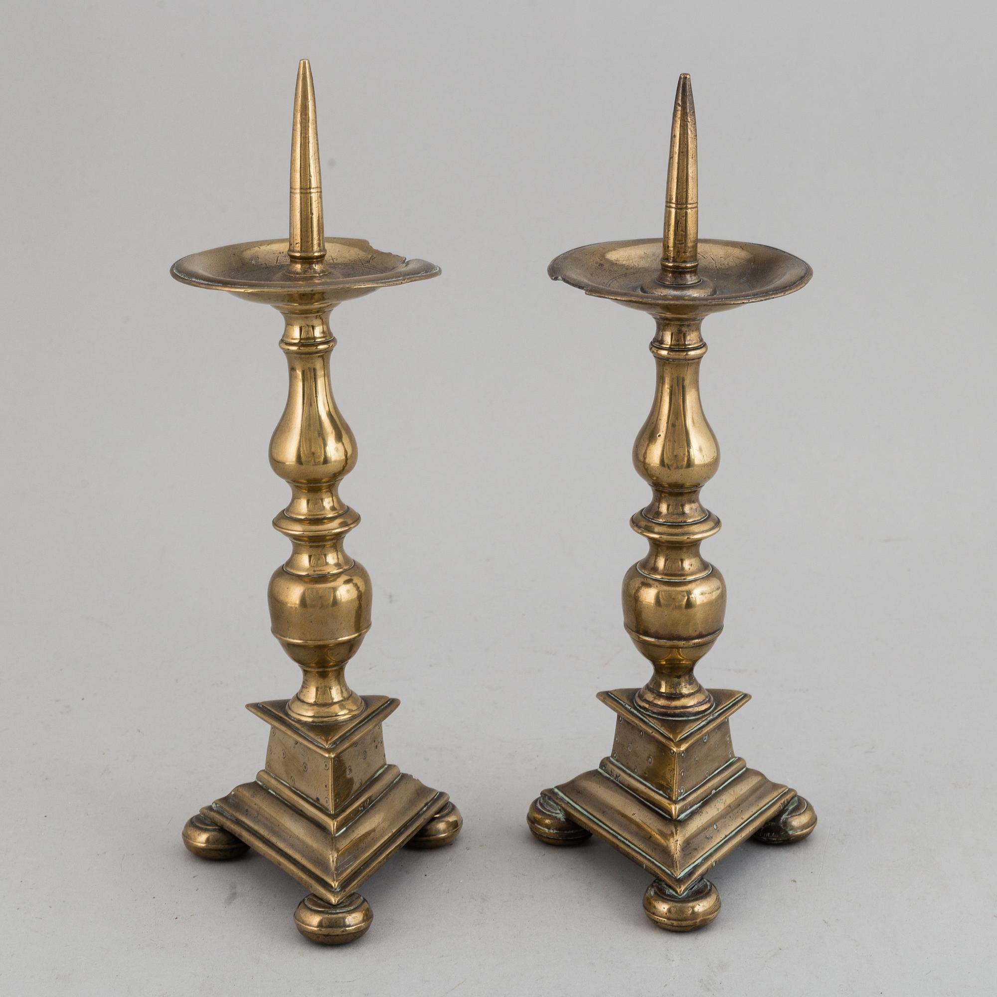 A pair of 17th century bronze candlesticks.