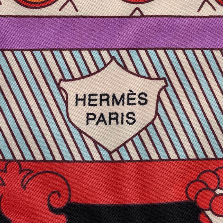Hermès, a 'Twilly' silk scarf.