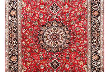 A Tabriz carpet, part silk, 50 raj, c. 325 x 208 cm.