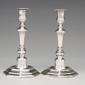 A pair of European 18th century silver candlesticks, unidentified makers mark.