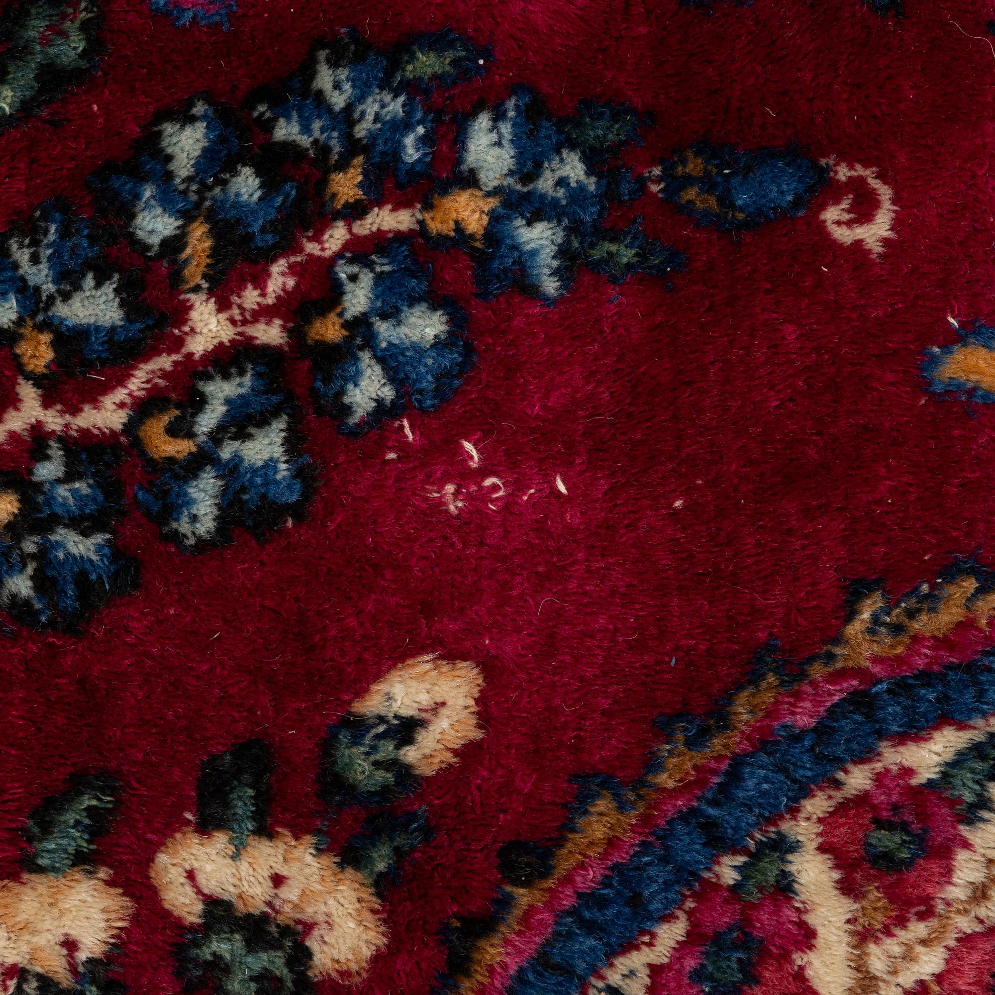A Kerman carpet, c. 365 x 265 cm.