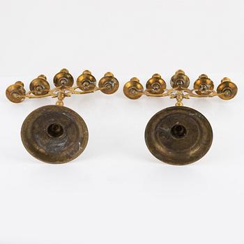 A pair of brass candelabras, early 20th century.