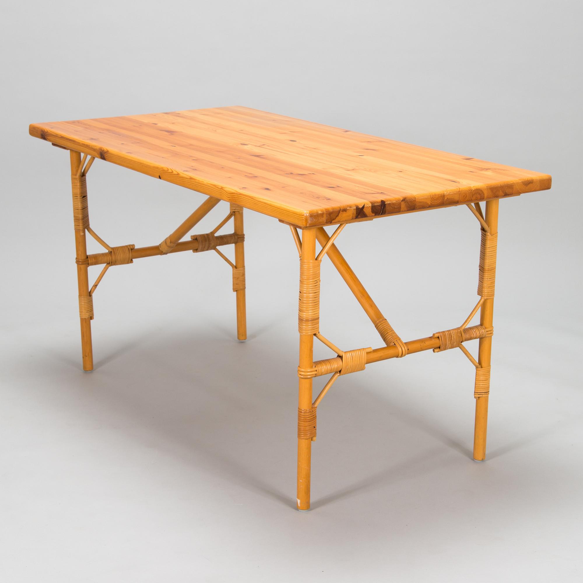 A pine wood and rattan table, late 20th century.