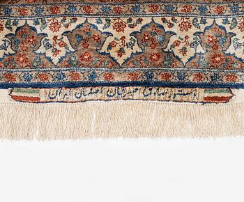 A semi-antique silk Isfahan rug, Central Persia, signed (Sadegh) Seirafian, c. 209 x 142 cm.