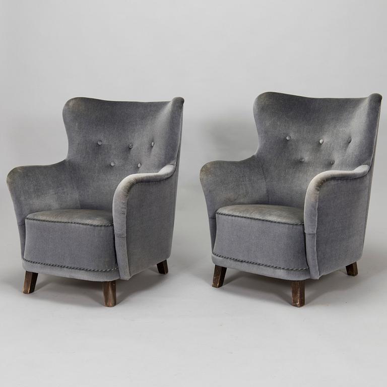 A pair of mid-20th century armchairs.