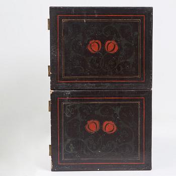 A lacquered cabinet, in two sections, Qing dynasty, 19th Century.