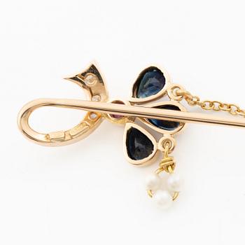Lapel pin, 18K gold with brilliant-cut diamonds, sapphires, a ruby and pearls.