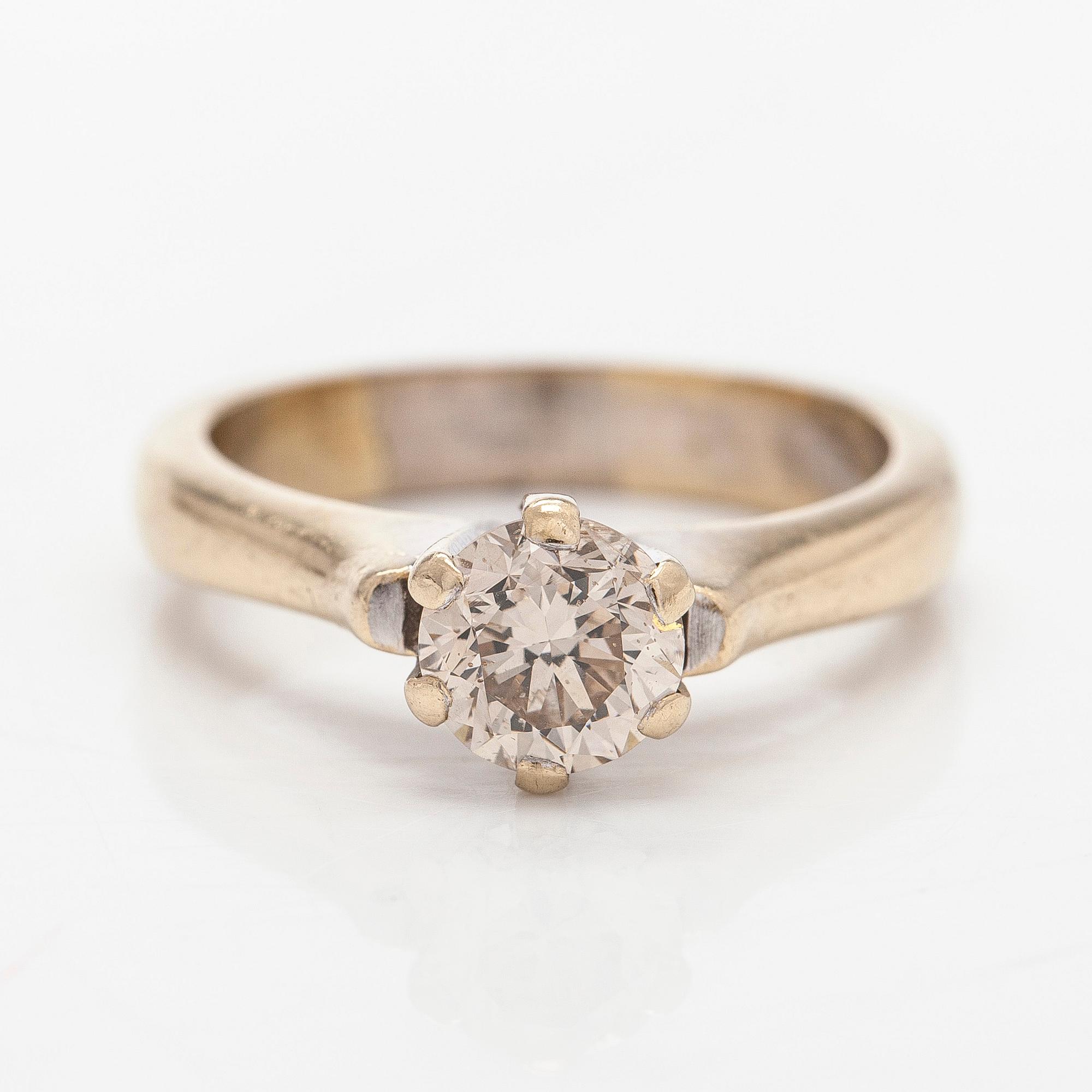 Ring, 18K guld med en briljantslipad diamant.