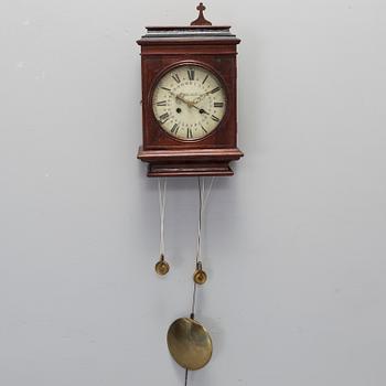 A 19th century wall clock.