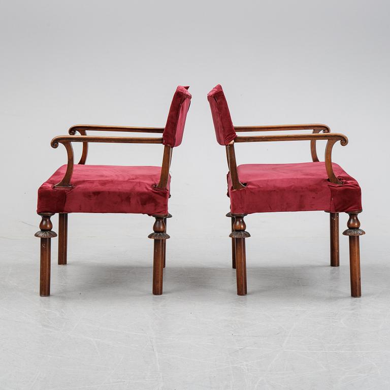 A pair of Swedish Grace 1920's armchairs.