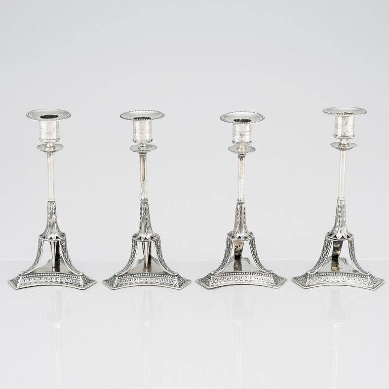 A set of four Swedish early 19th Century silver candlesticks, mark of Adolf Zethelius, Stockholm 1814 and 1818.