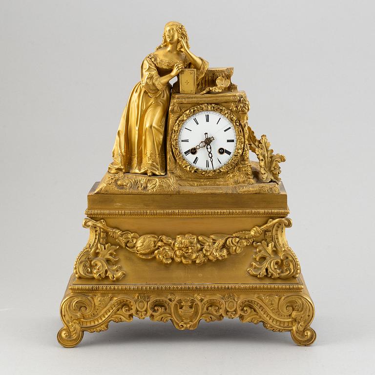 A rococo style brass mantle clock, second half of the 19th Century.