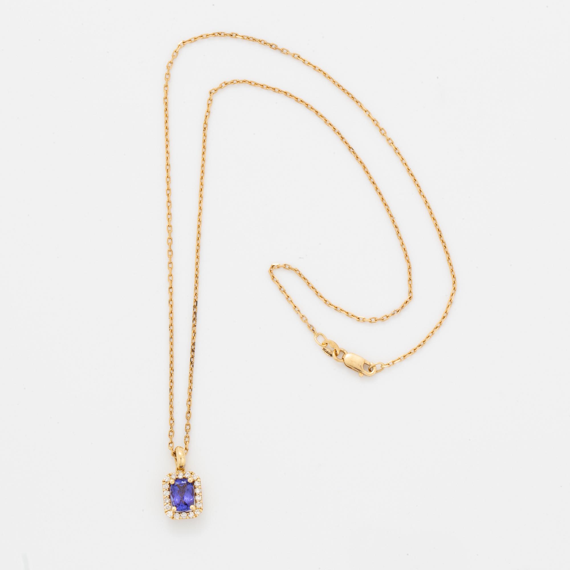 An 18K gold necklace set with a faceted tanzanite.