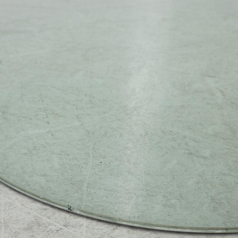 A dining table, glass, contemporary.