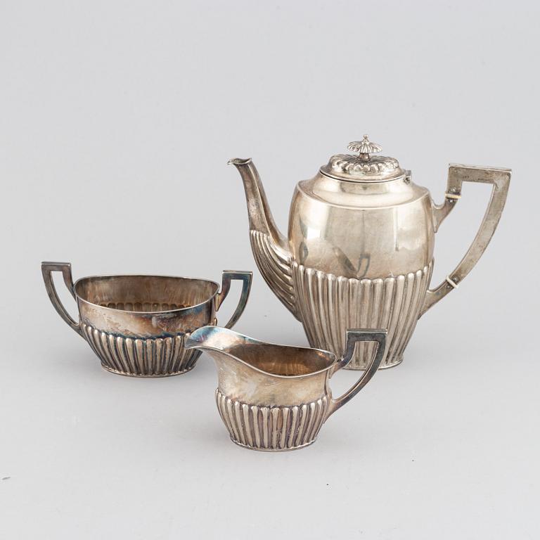 A silver coffee pot, creamer and sugar bowl, AG Dufva, Stockholm 1914.