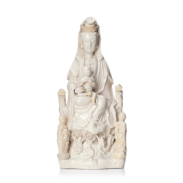 A Chinese blanc de chine Guanyin with attendants, Dehua, late Ming dynasty/early Qing dynasty.