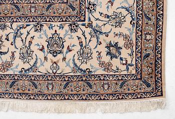 A Nain part silk carpet, c. 535 x 340 cm.
